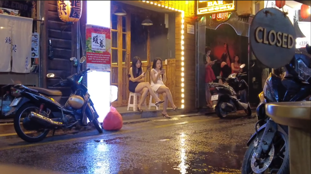 Bar girls outside waiting for customers