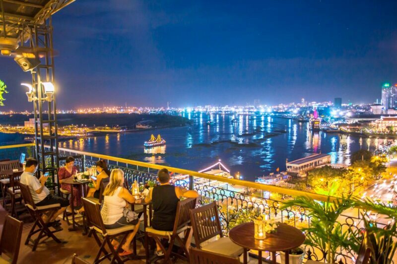 A couple having a drink on a Rooftop Bar in Ho Chi Minh City