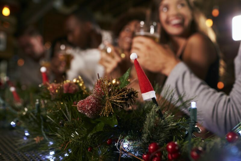 Christmas party at a bar, focus on foreground decorations