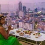 young women having a drink on a rooftop bar