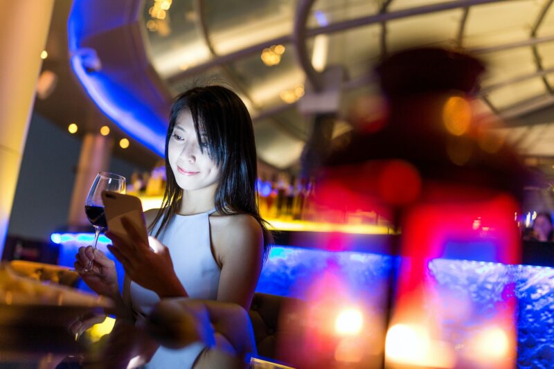 Woman Drinking Wine in a Vietnam Lounge